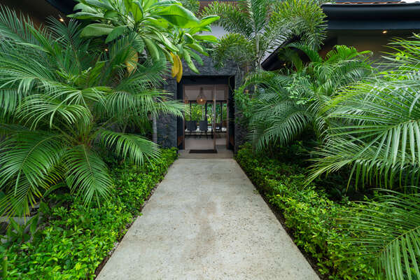 Experience a home embraced by nature's lush greenery!