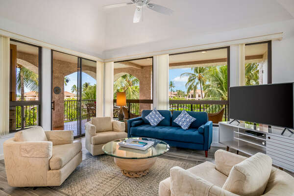Living room with comfortable seating, cable tv, and access to wrap around lanai
