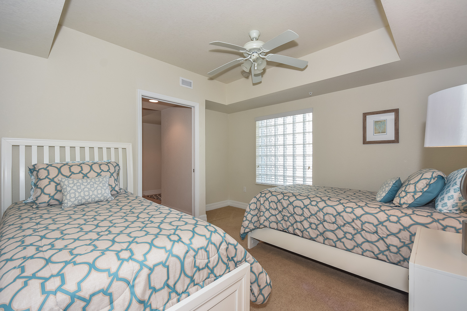 Bedroom with two twin size beds and ceiling fan