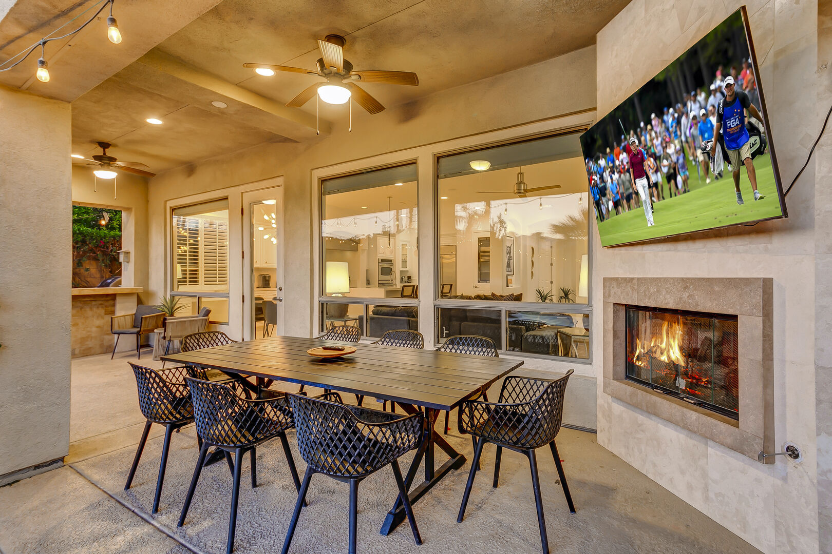 Dine by the outdoor fireplace on the patio dining table with seating for eight!