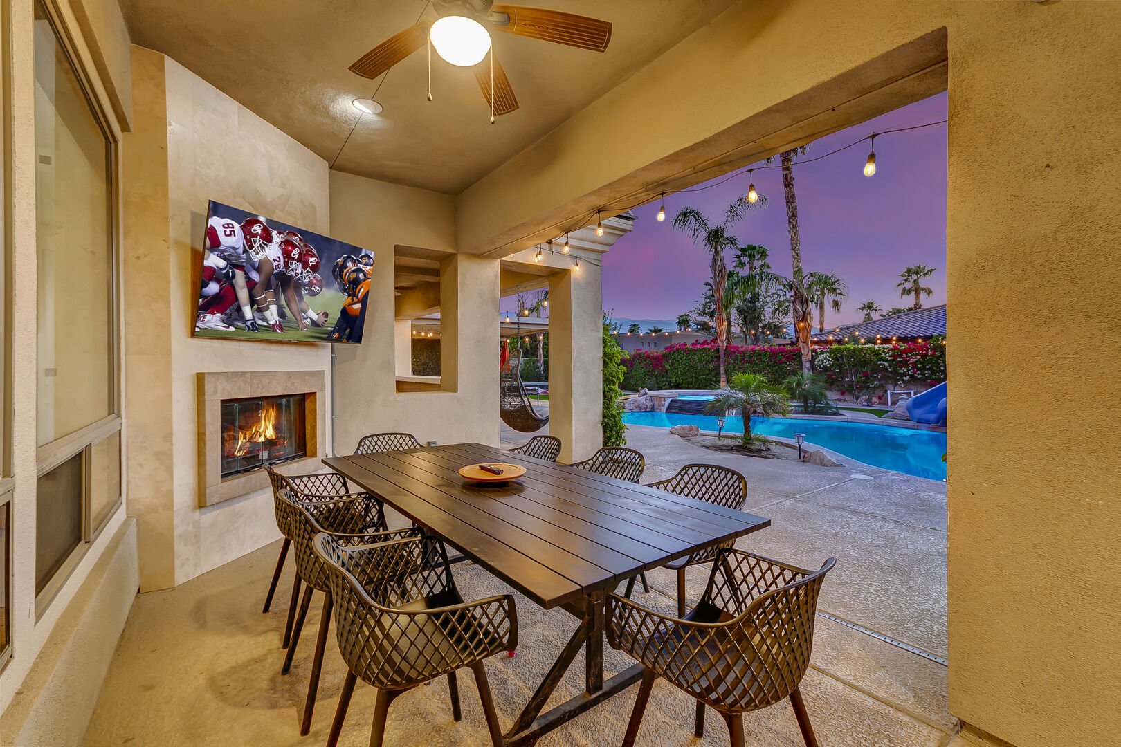 Stay cool under the ceiling fan and watch your favorites sports from the outdoor TV.