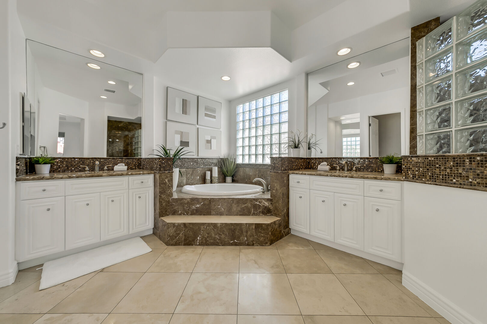 Master Suite 1 bathroom features a Vanity, dual his & hers sinks, step in shower, and huge soaking tub!