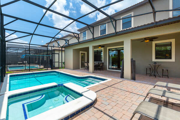 Step outside to a private screened-in pool area