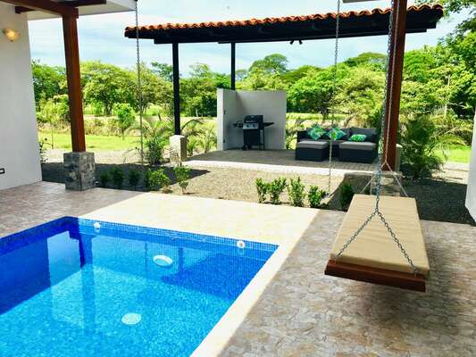 Experience the unique poolside swing at Casa Palma