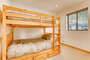 This bedroom has bunk beds that are both double beds.