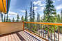 The expansive deck has magnificent mountain views. There is a gas grill and outdoor furniture.