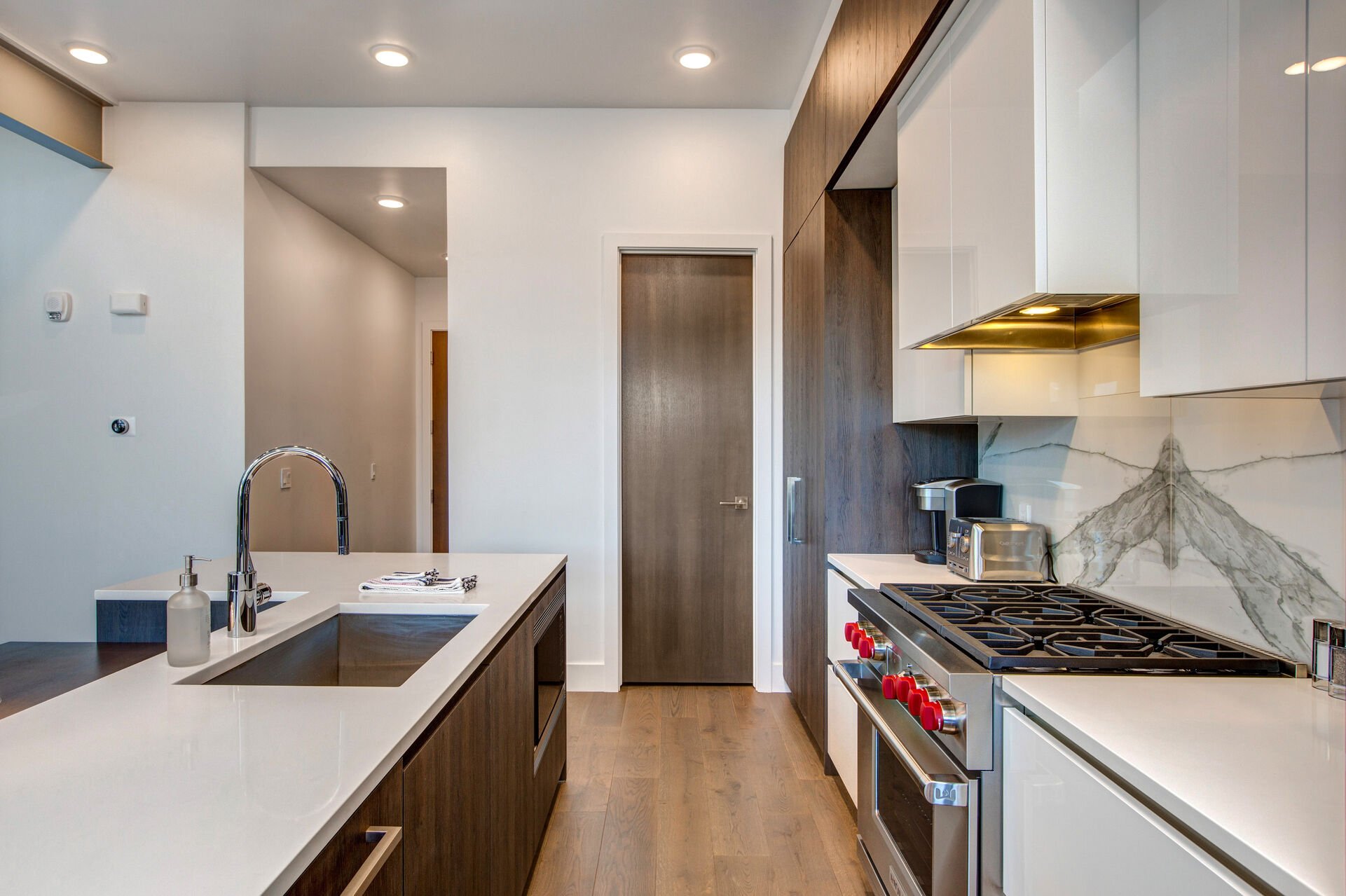 Gourmet Kitchen with High-end Stainless Steel Appliances, Including a 6-Burner Wolf Gas Range