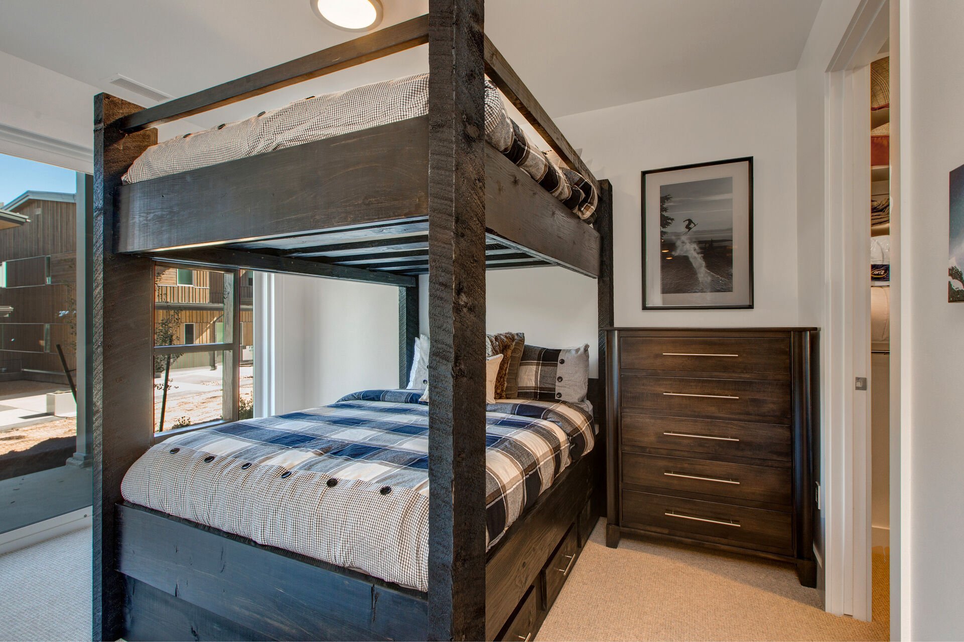 Lower Level Bedroom 4 with a Custom Queen over Queen Bunk Bed with a Twin Trundle and Patio Access