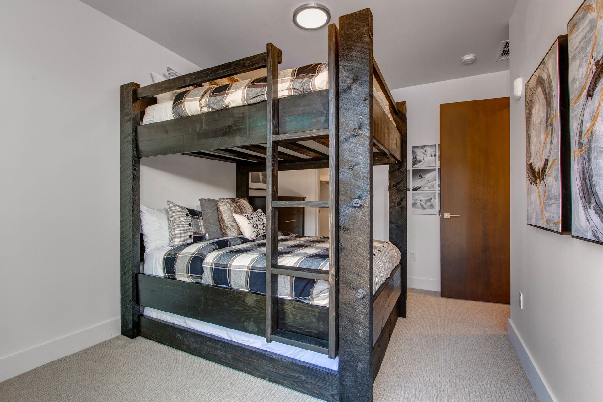 Bedroom 4 with a Custom Queen over Queen Bunk Bed with a Twin Trundle, a Walk-in Closet, and Full Shared Bath Access