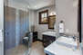 En Suite
Master Bath with Two Separate Vanity Sinks, a Large Tiled Shower and Water Closet