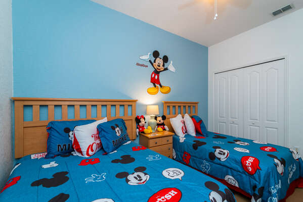 Bedroom 4 has twin beds and a Walt Disney theme