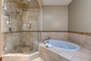 Master Bath with a Jetted-Tub a Large Tile Shower with Dual Shower Heads