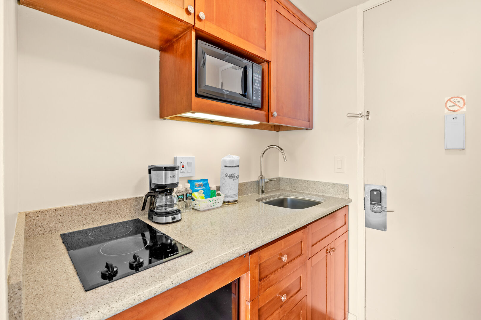 Kitchenette with sink, microwave, mini-fridge, and 2-burner stove