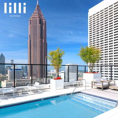 Image of Rooftop Pool and Surrounding Lounge Chairs.
