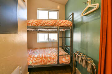 Bunk beds with folded chairs
