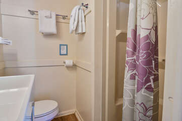 Shower and Bathroom with Floral Shower Curtain