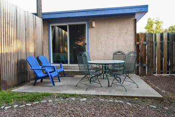 Private patio with table and chairs in our Rose Tree #1 unit.