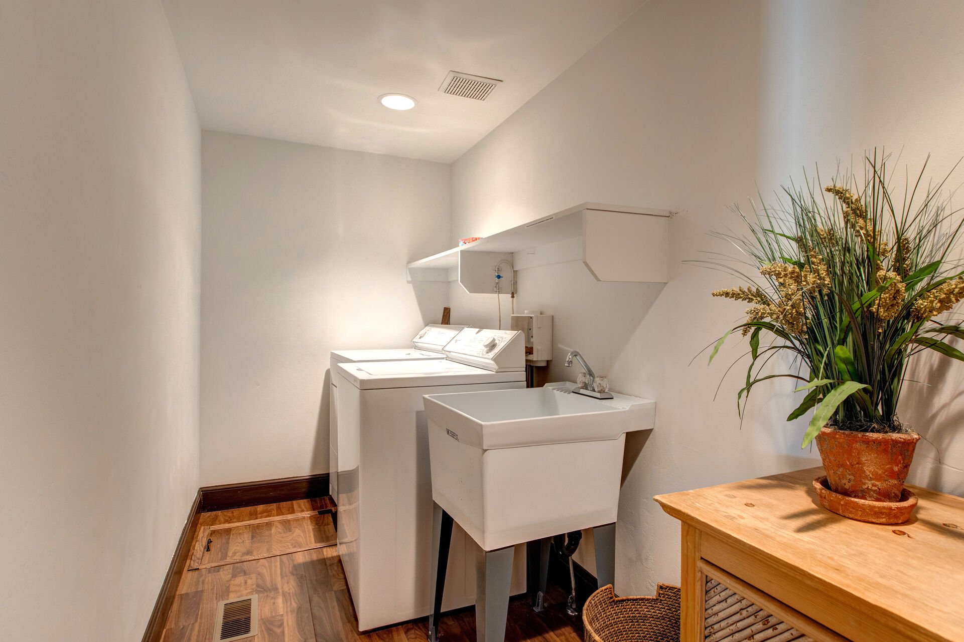 Laundry Room Located on Lower Level with Washer, Dryer and Utility Sink