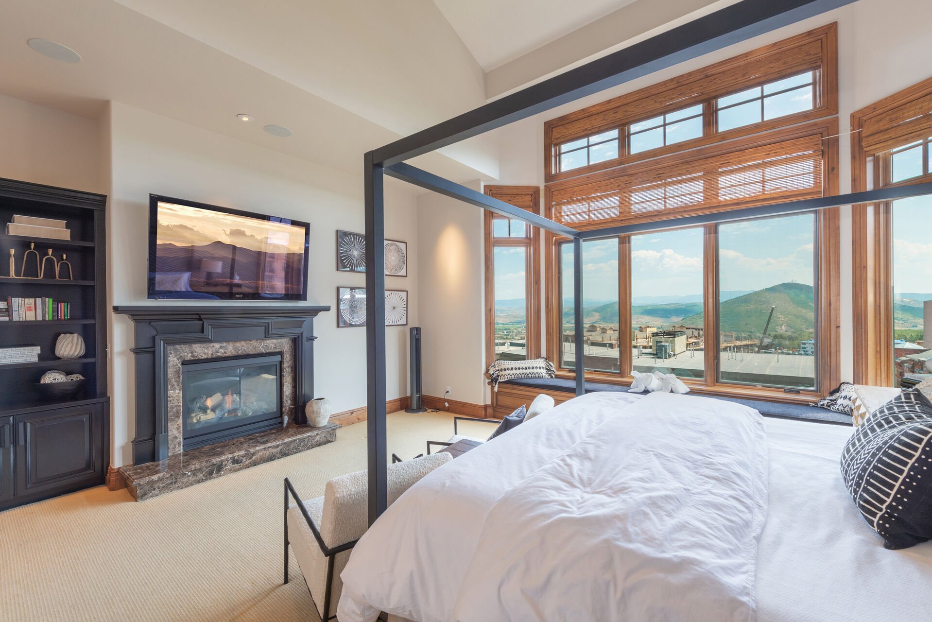 Master bedroom ensuite bathroom with gas fireplace and sweeping valley views.