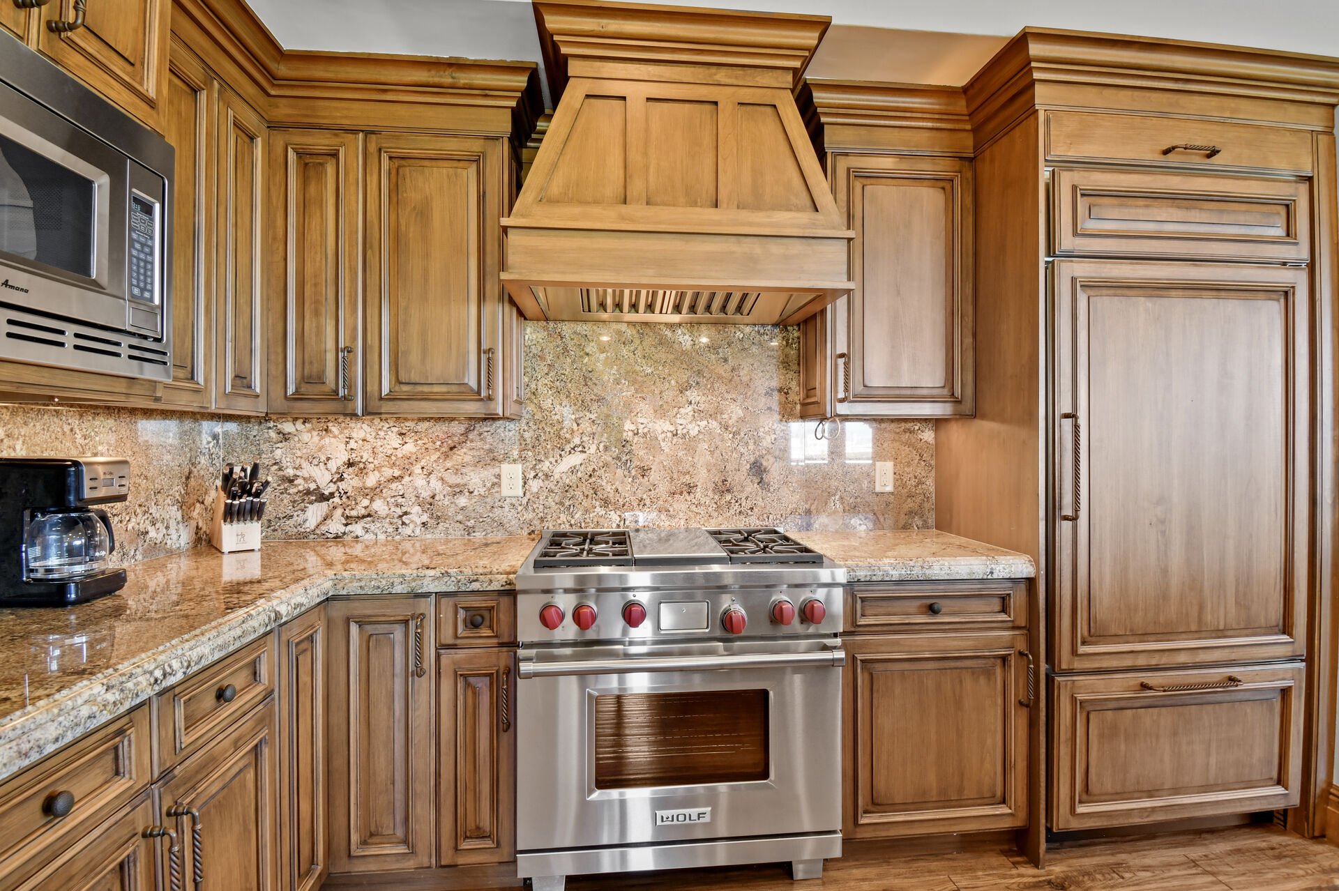 High end stainless steel appliances throughout the kitchen