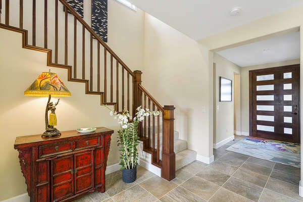 The front entryway of this Kona Hawaii vacation rental with stairs leading to the upper floor.