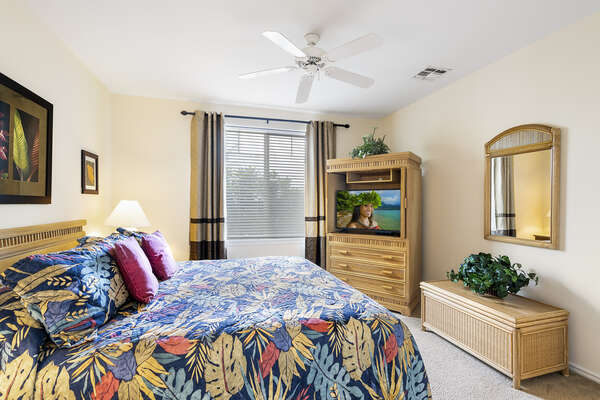 Bedroom with Tropical Decor and TV at Waikoloa Hawai'i Vacation Rentals