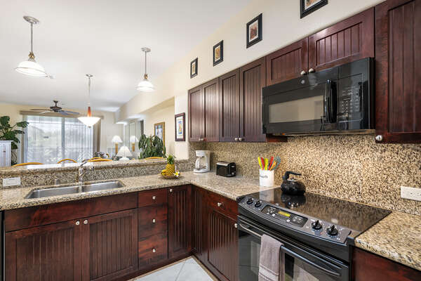Fully Equipped Kitchen with Black Appliances