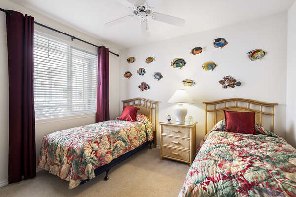 Bedroom with Fish Wall Art and Tropical Bedspreads