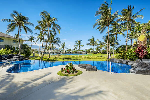 Infinity Pool Surrounded by Palm Trees at Waikoloa Hawaii Vacation Rentals