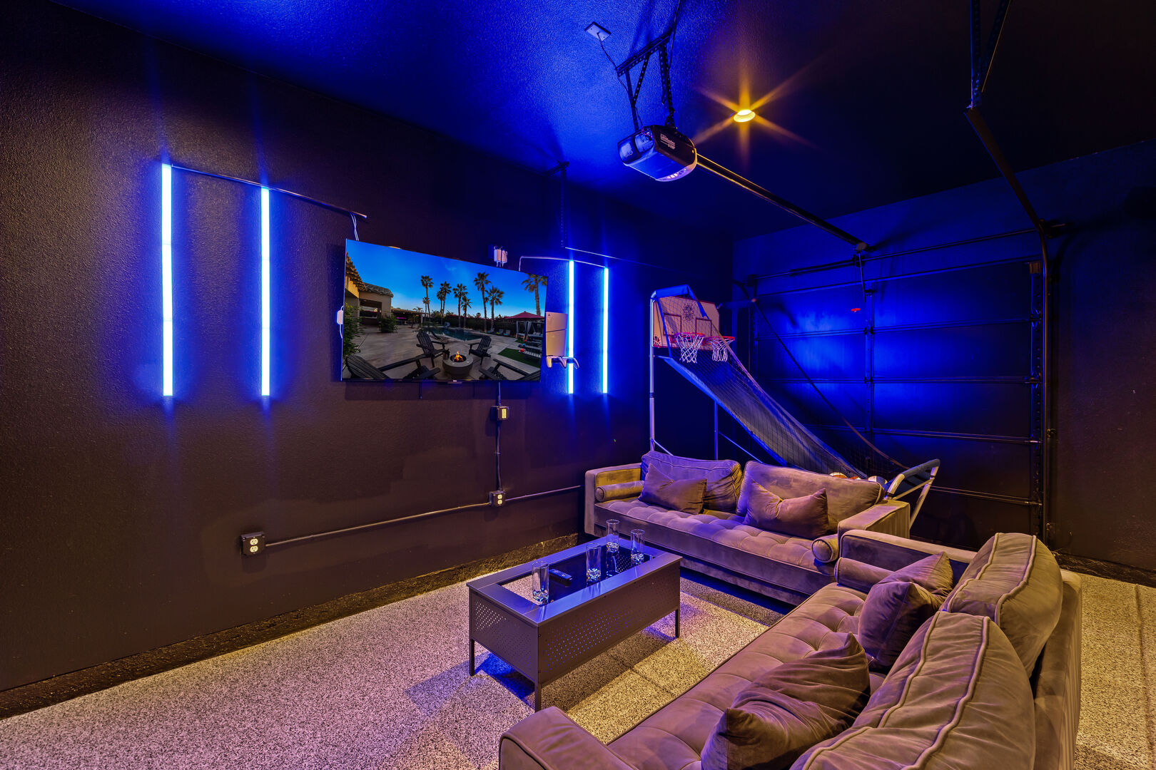Encore's game room features a comfortable couch for relaxing between rounds of gaming fun.