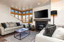 Cozy Main Level Living Room with a Gas Fireplace and 65