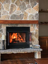 Cozy up by the wood burning fireplace
