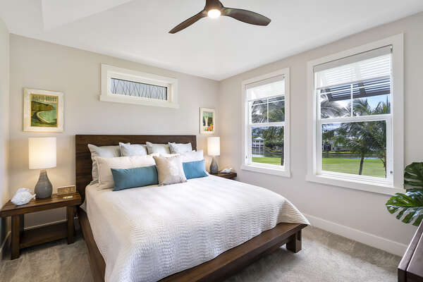 Master Bedroom with Tropical Decor and Large Windows