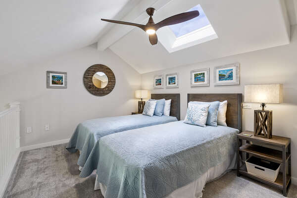 Loft Bedroom with Two Twin Beds with Blue Linens