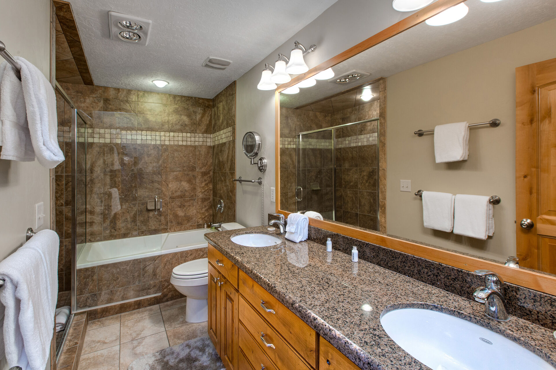 Master Bath with Dual Granite Counter Sinks and a Tub/Shower Combo