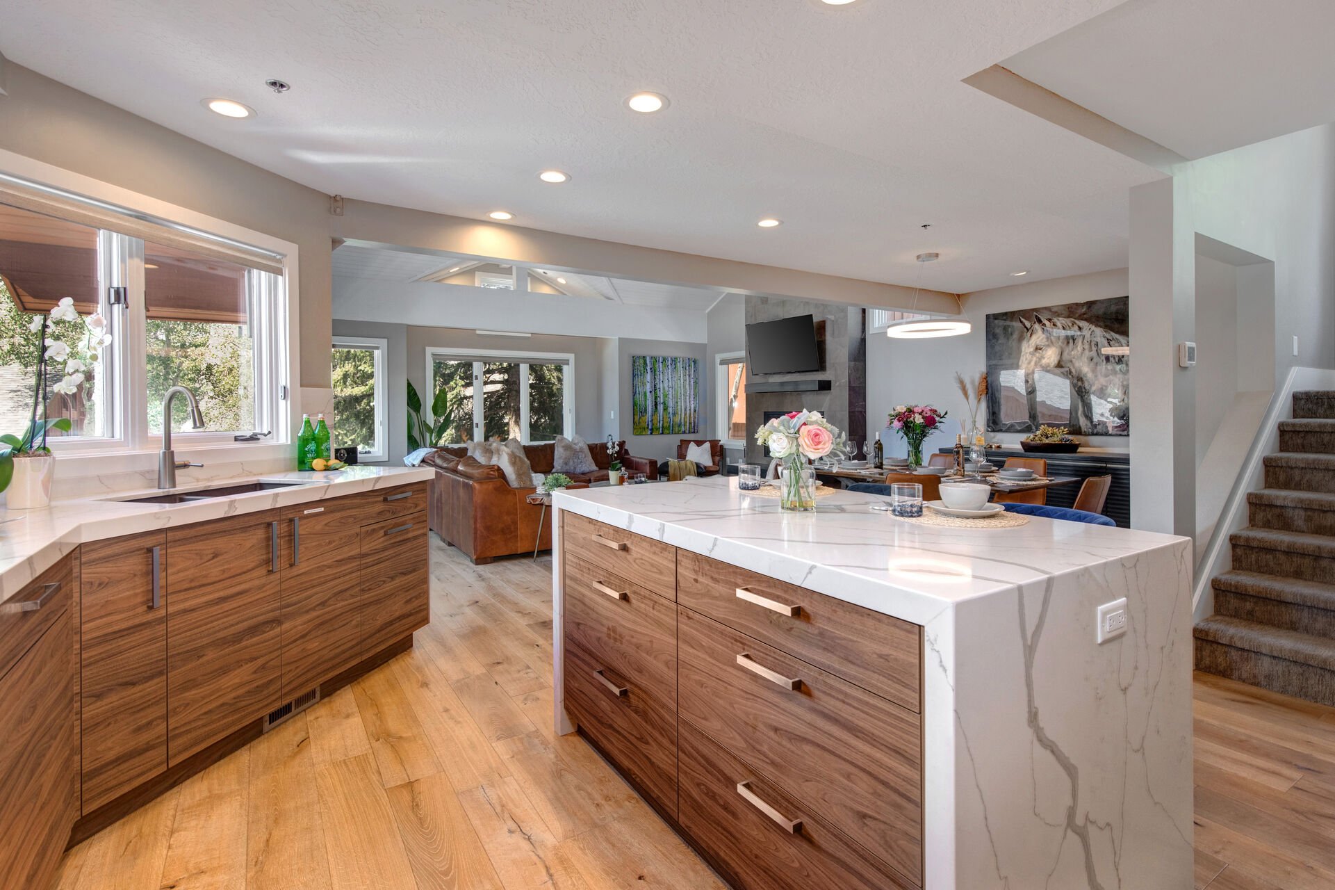 Gourmet Kitchen with a Center Island Seating and Beautiful Marbled Countertops