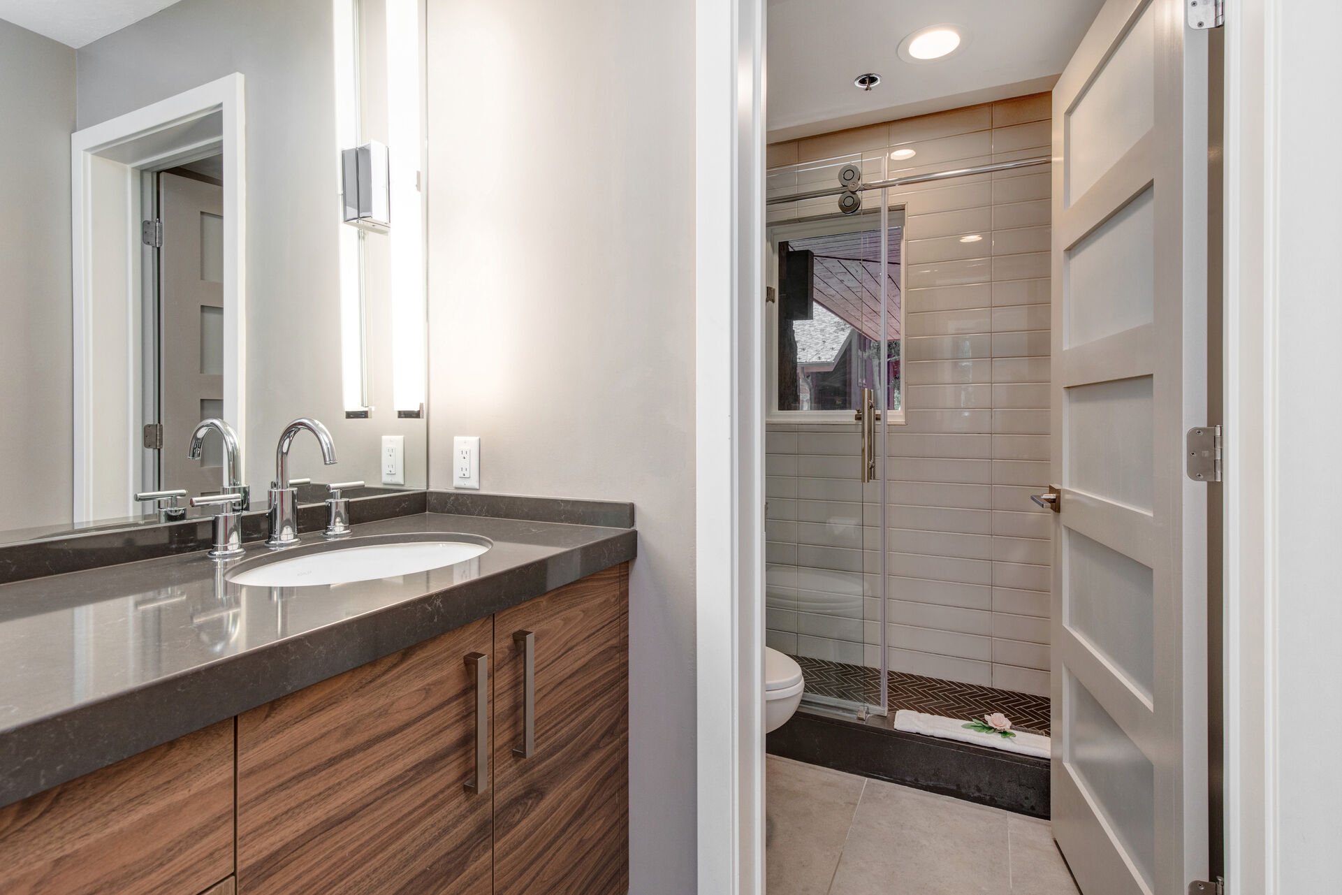 Lower Level Full Shared Bath with Dual Sinks, and Separated Washroom/Shower Area