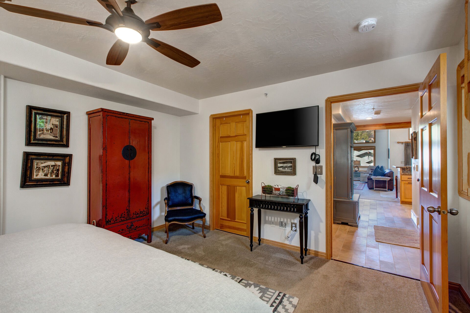 Main Level Master Bedroom with a King Bed, Smart TV, and Private Access to a Full Shared Bath