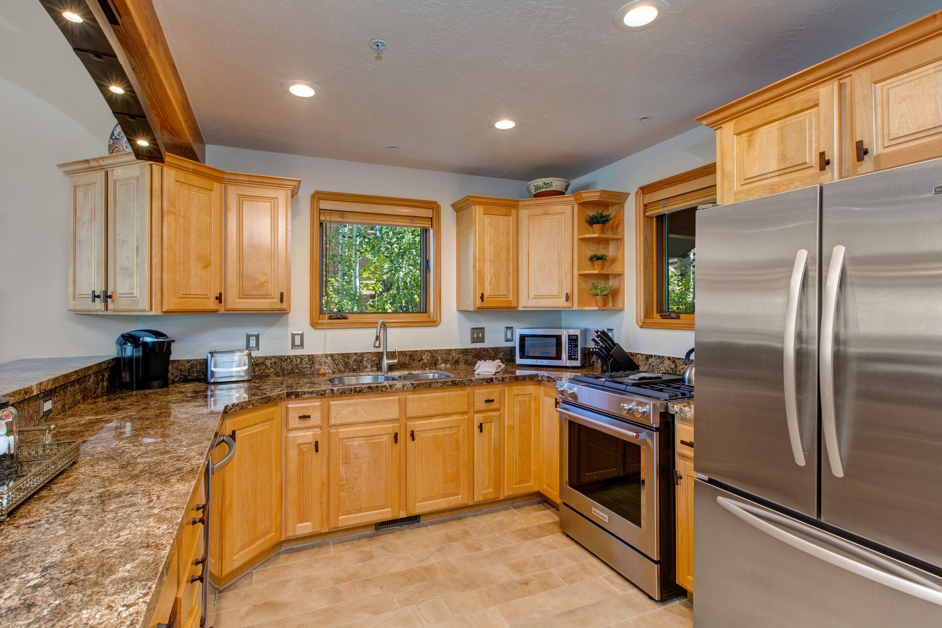 Fully Equipped Kitchen with Gorgeous Granite Countertops, New Stainless Steel Appliances, Including a Gas Range