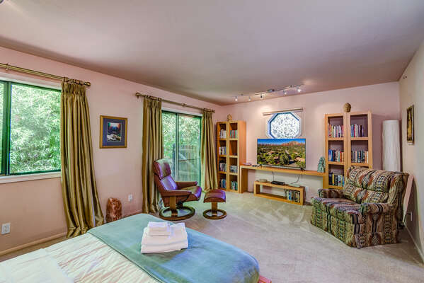 Generous Master Suite with a Smart TV and Private Deck