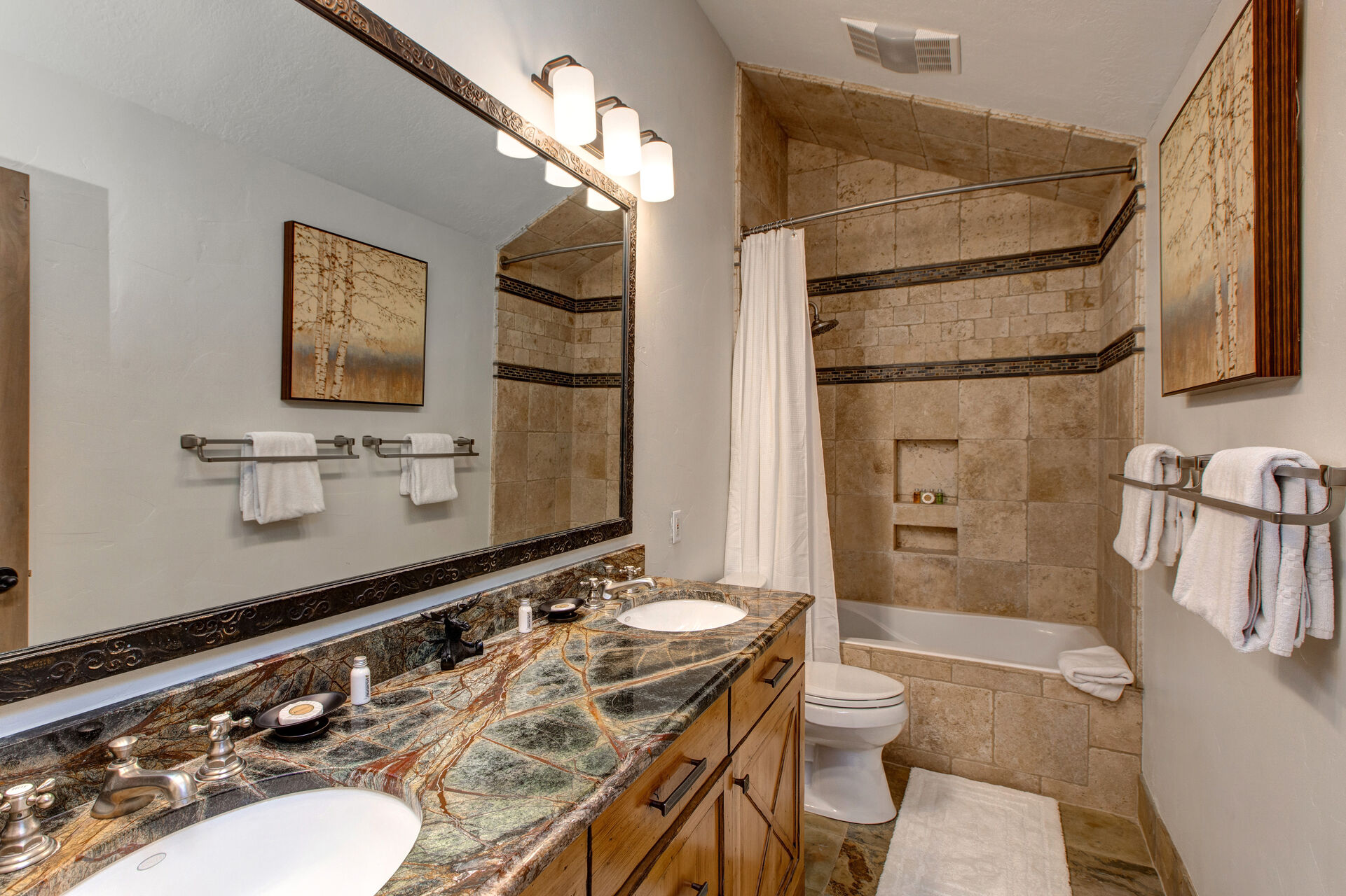Upper Level Shared Full Bath with Dual Granite Counter Sinks and Tub/Shower Combo