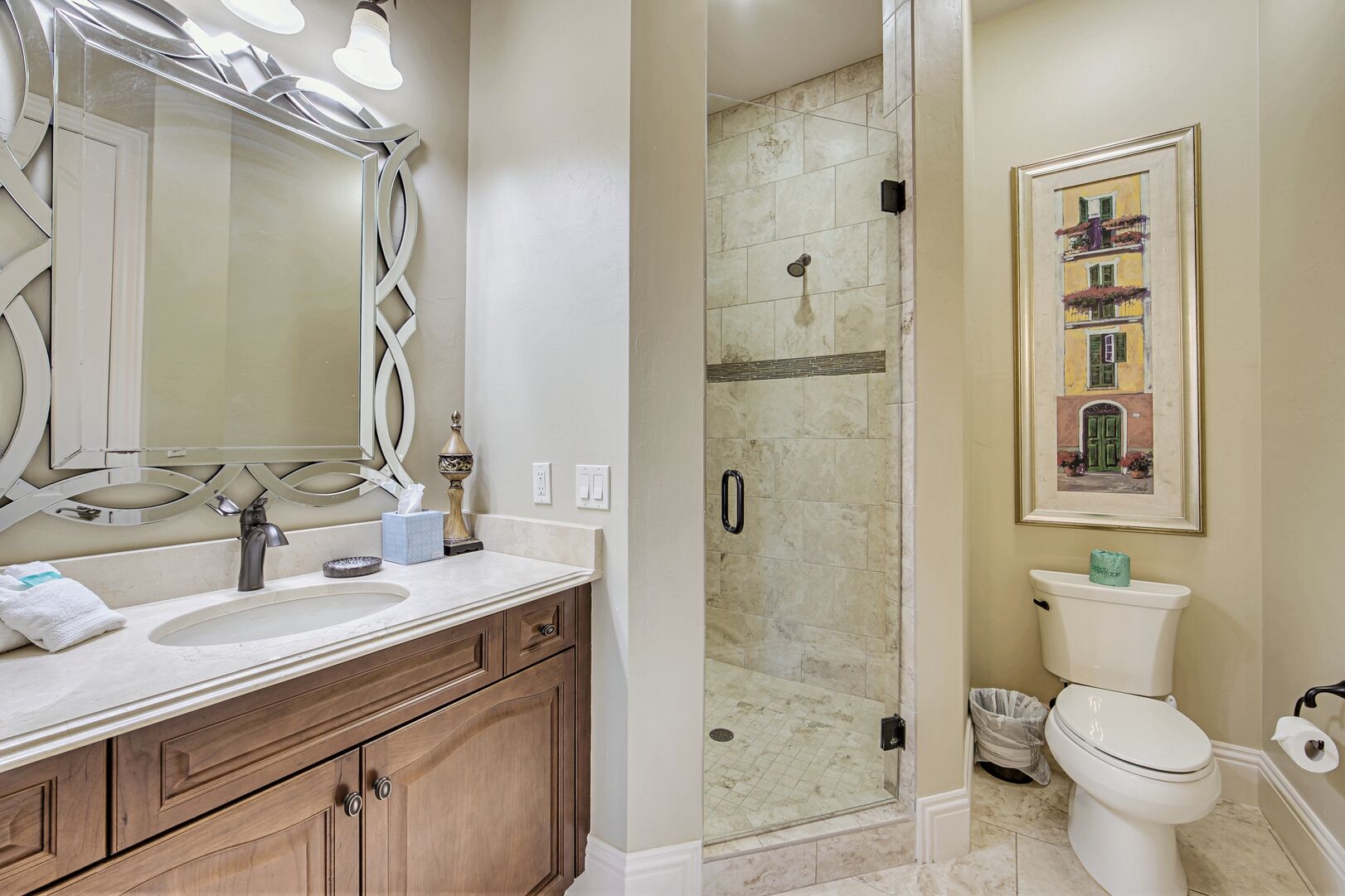 Bathroom with Shower, Toilet, Single Vanity Sink, and Mirror.
