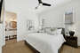 Guest bedroom with TV, Ceiling Fan & En Suite.
