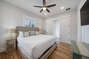 Bedroom with ceiling fan and two night stands