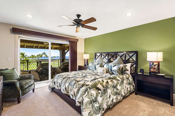 Master bedroom with King bed, additional seating, and twin armchairs.