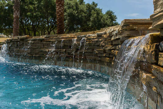 Enjoy the Sounds of the Waterfall That Also Flows Over from the Hot Tub
