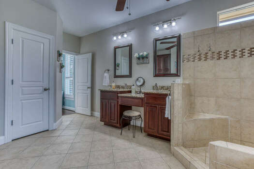Dual Sinks, a Makeup Vanity, and Large Tile Shower