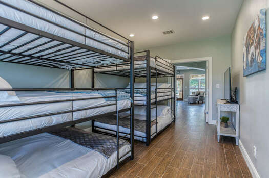 Main Level Bunk Room with Two Sets of Triple Luxury Queen Bunk Beds
