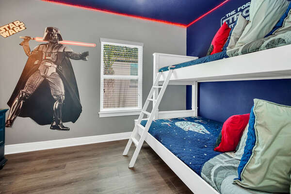 Kids will love this galactice bedroom with a twin/full bunkbed