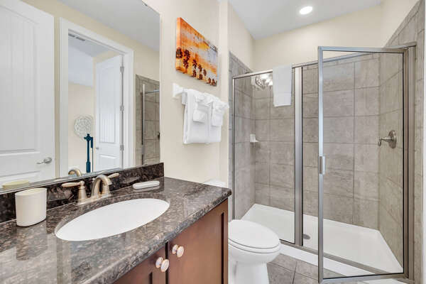 The ensuite bathroom is complete with a walk-in shower
